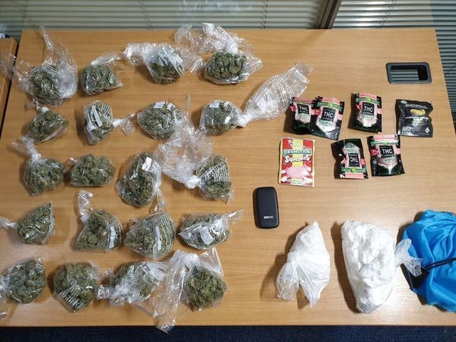 Bags of cannabis and cocaine were found stashed inside the vehicle, along with packets of sweets-flavoured synthetic cannabinoids and a mobile phone