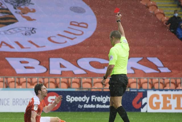 James Husband was sent off during the game with Lincoln City at Bloomfield Road