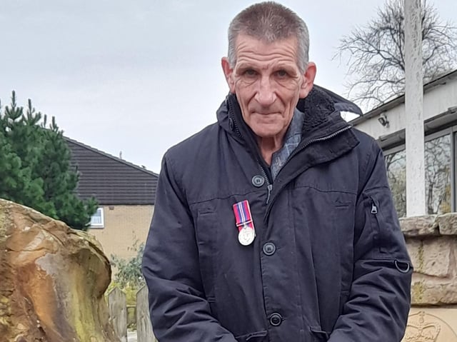 Frank Bryszkiewski wearing his father's medal at the memorial in Longridge