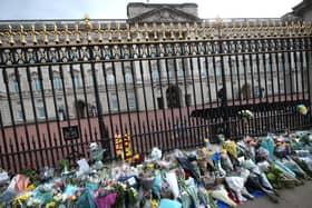 Floral tributes are left outside Buckingham Palace, following the announcement of the death of the Duke of Edinburgh at the age of 99. Picture date: Friday April 9, 2021. Picture: PA Wire/PA Images/Yui Mok