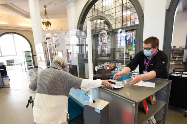 Lilian Ward checks out her new books at Blackpool Central Library. Photo: Daniel Martino for JPI Media