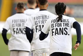 Leeds players wore 'football is for the fans' t-shirts before their game against Liverpool on Monday night