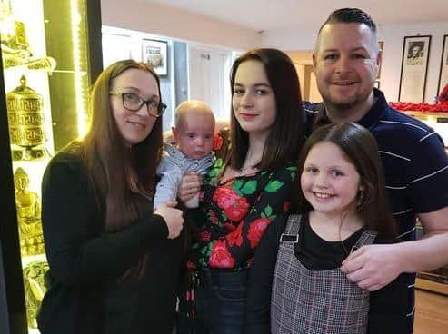 Chris Peachey, 38, has died following a three-year battle with oesophageal cancer. He is pictured with wife Lisa, son Oscar, step-daughter Leah and daughter Daisy. Photo: Lisa Peachey