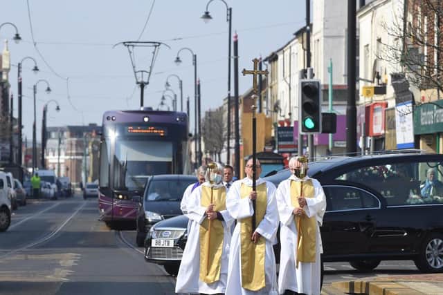Six members of the clergy lead the funeral cortege down Lord Street to St Peter's Church for the service