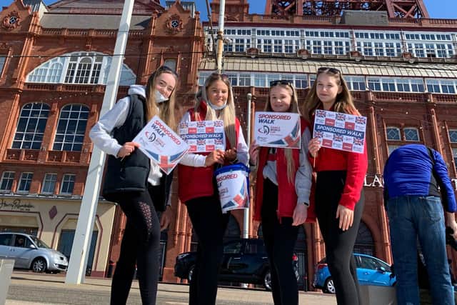 Emily Richards, 15, Ella-Rae Bailey, 14, Hannah Boden, 14, and Isobel Farey, 14, walked 45 km from Barbara Jacksons Theatre Arts Centre in Fleetwood to Blackpool Pleasure Beach - and back to raise funds for the Dance World Cup competition