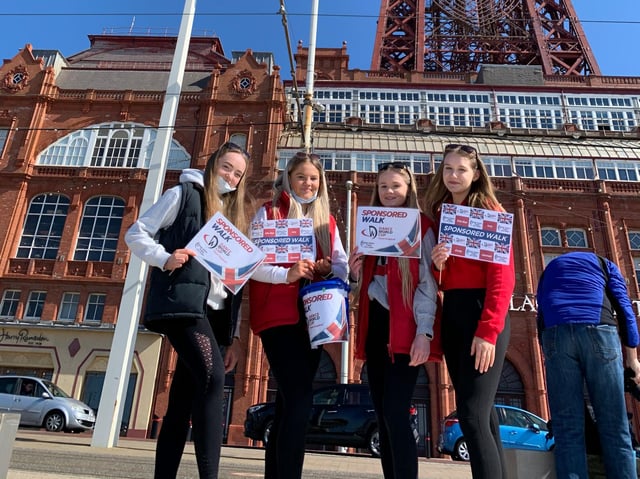 Emily Richards, 15, Ella-Rae Bailey, 14, Hannah Boden, 14, and Isobel Farey, 14, walked 45 km from Barbara Jacksons Theatre Arts Centre in Fleetwood to Blackpool Pleasure Beach - and back to raise funds for the Dance World Cup competition