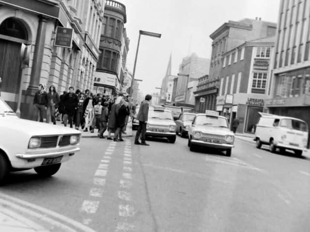 A typical afternoon in Preston town centre showing traffic on the roads