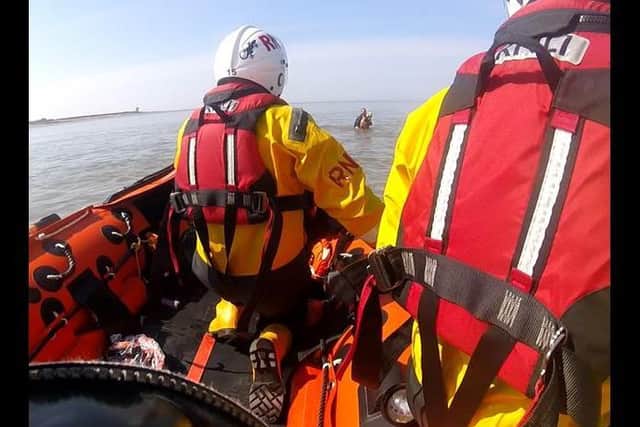 The Fleetwood Lifeboat crew heads towards Anne Brookes, who is struggling in the water.