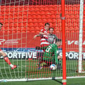 Barie McKay scores for Fleetwood at Doncaster