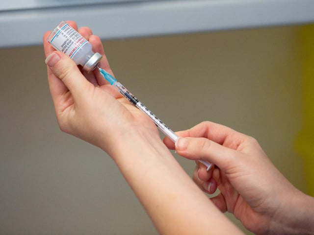 A healthcare professional draws up a dose of the Moderna Covid-19 vaccine.
