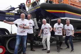 Roy and Phil Walker with RNLI representatives at the St Annes boathouse