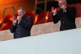 Chief executive Ben Mansford and director Brett Garrity applaud the players off the pitch at the Stadium of Light