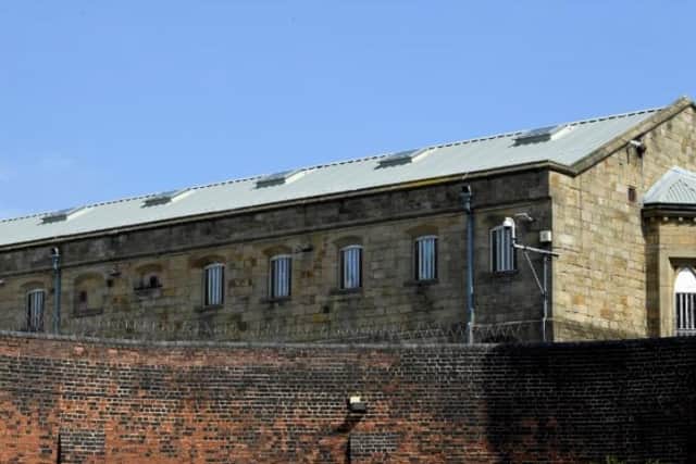 One wing at least of the Victorian prison has been badly hit.