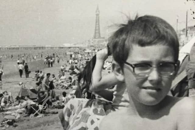 Damian on the beach in Blackpool as a child