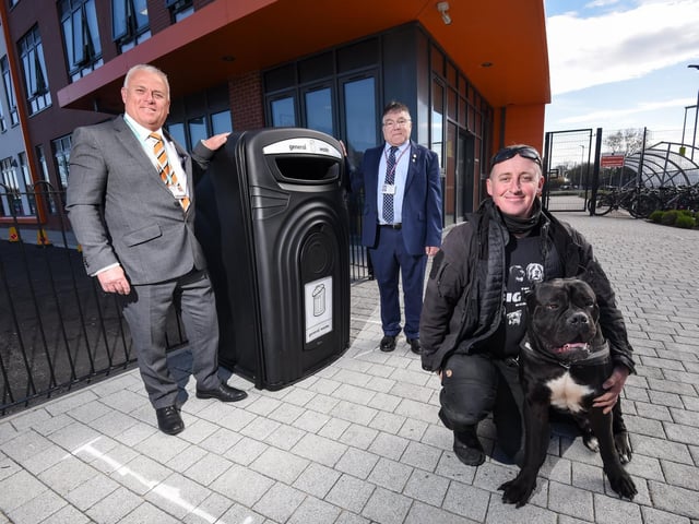 John Topping, Coun Derek Robertson and dog walker Darren Mason with Kenzo