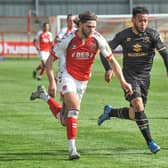 Wes Burns takes on the MK Dons defence as Fleetwood's improved performance pleased boss Simon Grayson