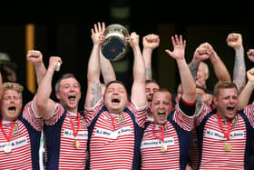 Fylde's Adam Lewis lifting the Bill Beaumont Cup as Lancashire captain at Twickenham in 2016