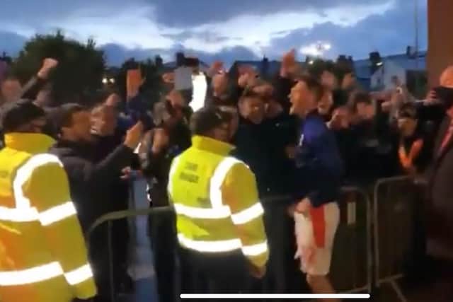 Jerry Yates celebrates with Blackpool's fans outside Bloomfield Road. Screengrab taken from Blackpool FC's Twitter
