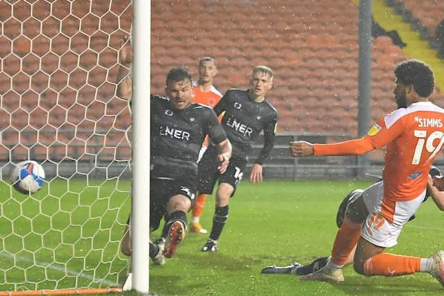 Andy Butler can't stop Ellis Simms from scoring his second goal of the night