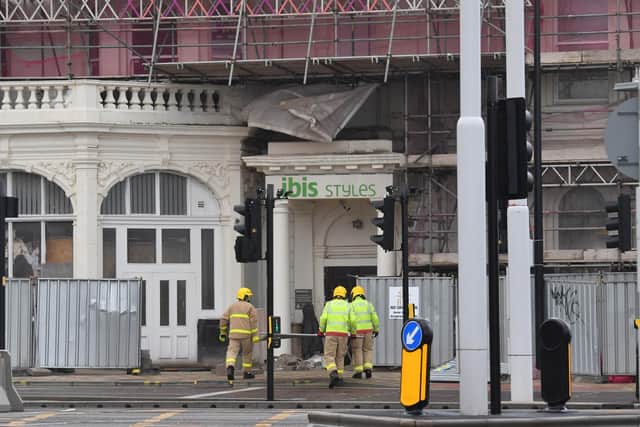Firefighters work to secure the steel fencing surrounding the Ibis Hotel in Blackpool.