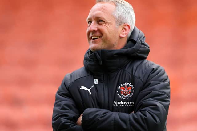 Neil Critchley can afford a smile but knows the job isn't done at Blackpool this season