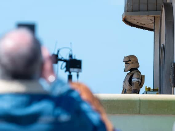 The Empire has arrived! Stormtroopers have been spotted outside Cafe Cove, which appears to have been transformed into a makeshift marketplace, with props used as stalls.