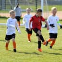 Under-8 Hogan Cup action between Thornton Cleveleys Tigers and YMCA Blacks at Burn Naze