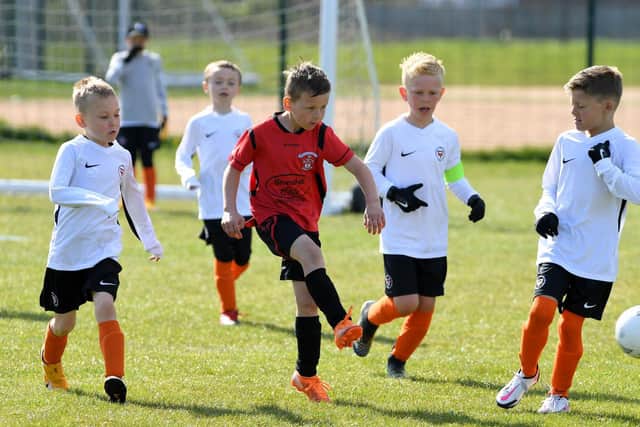 Under-8 Hogan Cup action between Thornton Cleveleys Tigers and YMCA Blacks at Burn Naze