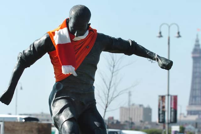 The Mortensen statue at the north end of Blackpool's ground, clad in the club colours
