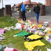 Flowers and football shirts left in memory of Jordan Banks