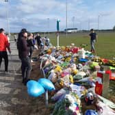 Flowers, footballs, balloons and cards left at Common Edge playing fields in memory of Jordan Banks