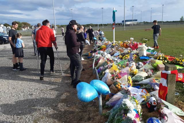 Flowers, footballs, balloons and cards left at Common Edge playing fields in memory of Jordan Banks