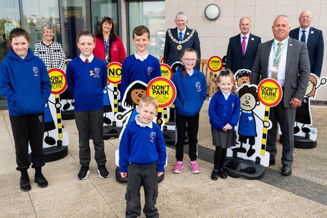 L-R: Maureen Harrison, Sue Robinson (headteacher), Tony Harrison (Provincial Grandmaster), Howard Lloyd, John Topping and Steve Kayne with school pupils from Blackpool Gateway Academy with the school buddies. Picture: Kelvin Stuttard/JPI Media