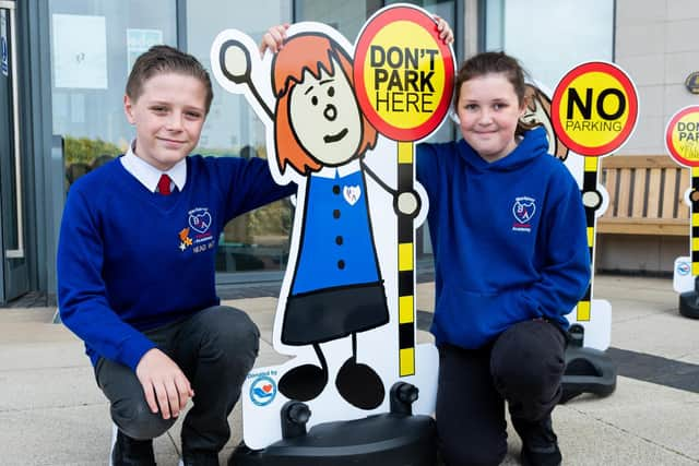 Head Boy and Head Girl Lincoln Newton and Darcy McKenna with a school buddy at Blackpool Gateway Academy. Photo: Kelvin Stuttard/JPI Media