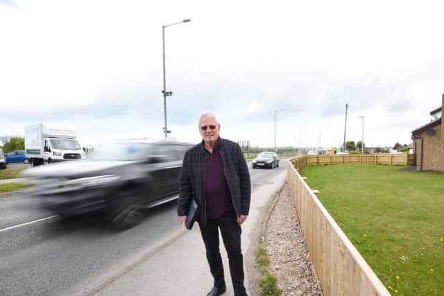 Coun Graham Baker at the junction
