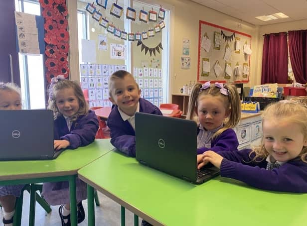 Children from St Wulstan's and St Edmund's Catholic Primary School test out new laptops donated to the school by Asda in Fleetwood