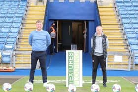 Karl Robinson and Neil Critchley posed in front of nine footballs prior to kick-off. Picture courtesy of Oxford United's Twitter account