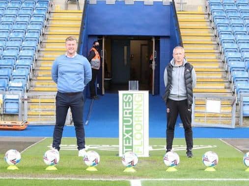 Karl Robinson and Neil Critchley posed in front of nine footballs prior to kick-off. Picture courtesy of Oxford United's Twitter account