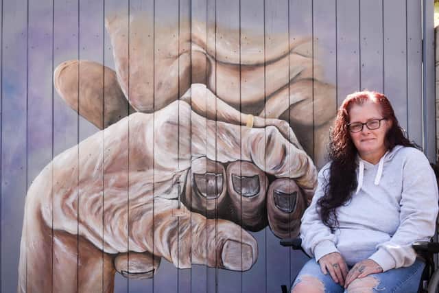 Kirsty Rea with her mural. Picture: Daniel Martino/JPI Media