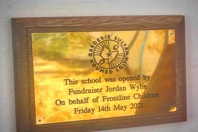 The plaque was placed on the newly built school