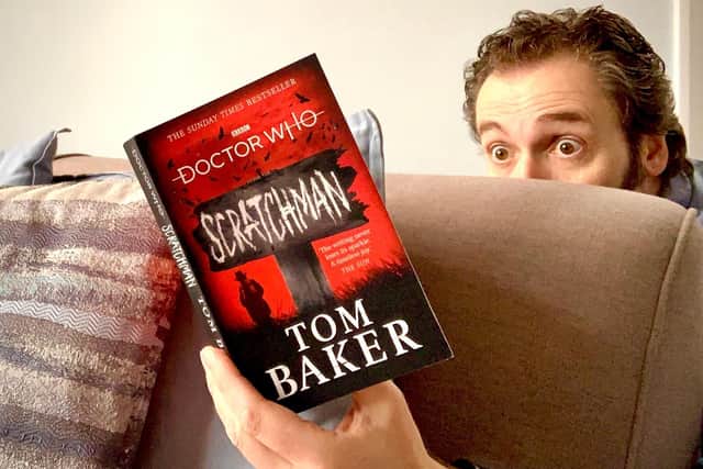 Author Chris Callaghan hides behind his sofa and indulges in Tom Baker's scary Doctor Who book 'Scratchman' during the #Take10ToRead challenge.