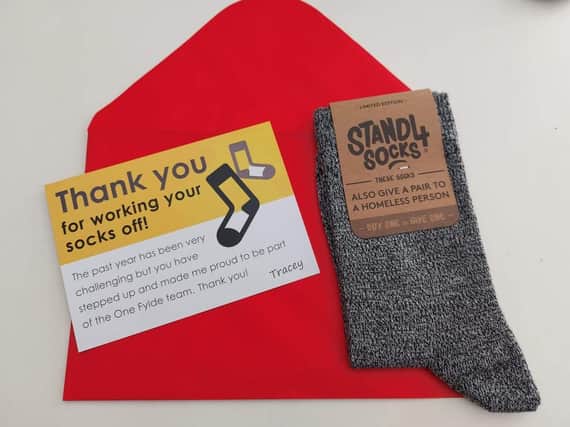 Staff said that their employer's decision to thank them with a pair of socks when many of them are struggling to get by was 'insulting' and 'dehumanising'