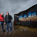 Graffiti artists Christian Seca One and Graham Morriss working on a crate on the Comedy Carpet to promote new Netflix movie Army of the Dead.