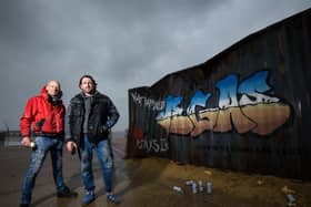 Graffiti artists Christian Seca One and Graham Morriss working on a crate on the Comedy Carpet to promote new Netflix movie Army of the Dead.