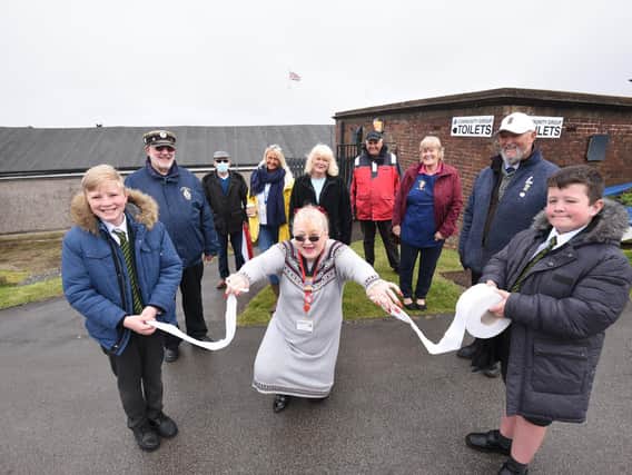 Grand reopening of refurbished toilets on Laidleys Walk in Fleetwood. Kalvin Townsend and Jack Anderton from Shakespeare Primary hold the toilet paper for Coun Mary Stirzaker to cut.