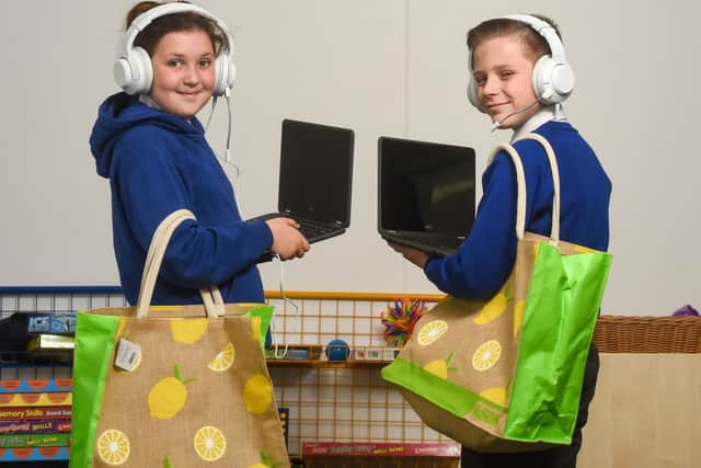 Lincon Newton, 10 and Darcy McKenna, 11 with their new laptops, courtesy of Asda supermarket in Cherry Tree Road, Blackpool. Picture: Daniel Martino/JPI Media