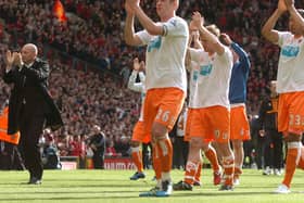 Blackpool players and manager Ian Holloway applaud the fans after their season ended in relegation