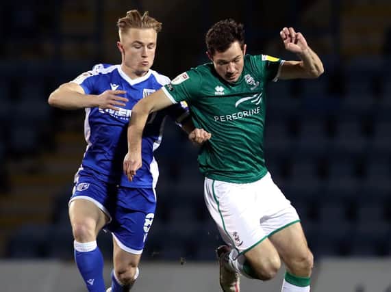 Kyle Dempsey (left) in action for Gillingham.
