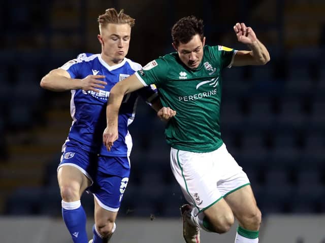 Kyle Dempsey (left) in action for Gillingham.