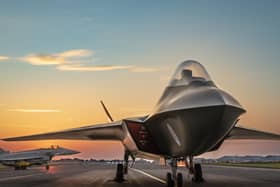 The full sized mock-up of the Tempest with a Typhoon on the runway behind it.